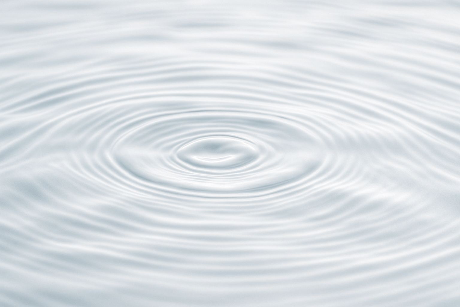 A still water surface with fine surface tension ripples.